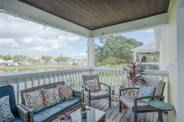 a view of a chair and tables in the balcony