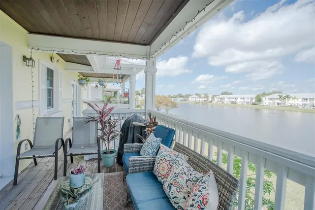 a view of a chairs and table in the balcony