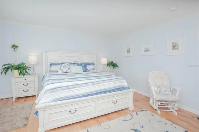 a bedroom with a bed and chair