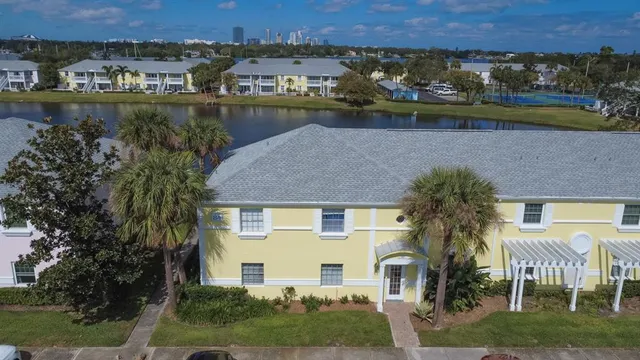 an aerial view of a house with a lake view