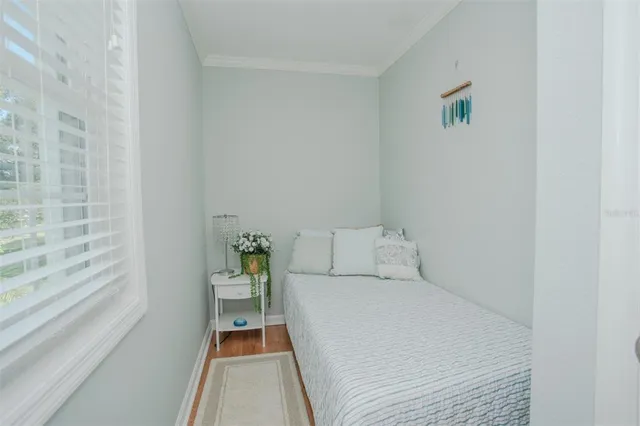 a bed room with a bed and a window