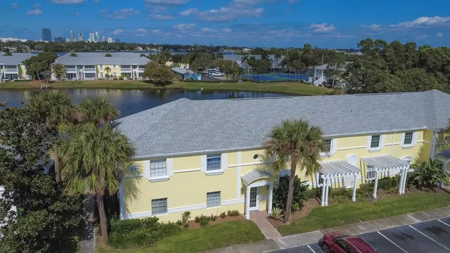 an aerial view of a house with a lake view