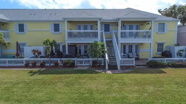 a view of a house with a yard and plants
