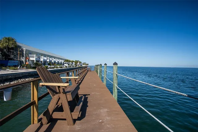 a front view of a building with tree s