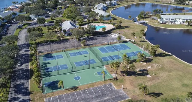 a front view of a house with a garden and plants