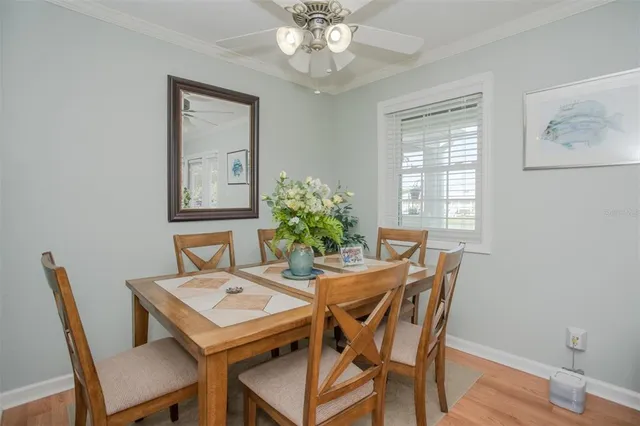 a view of a dining room with furniture and a chandelier