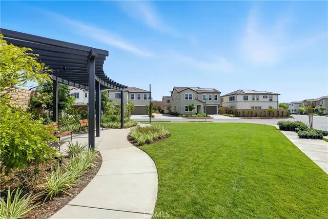 a view of a house with a yard porch and sitting area