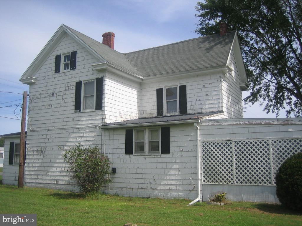 10012 Pitts Road Showell, MD 21862 - Photo 16 of 18 a front view of a house with a garden