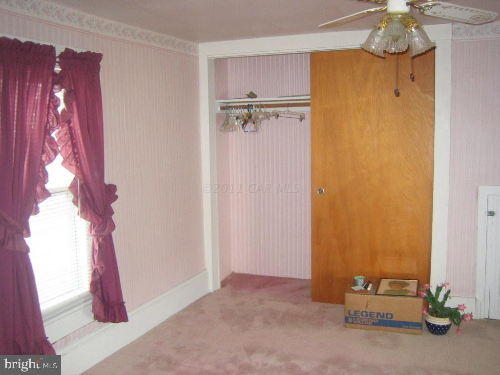 10012 Pitts Road Showell, MD 21862 - Photo 8 of 18 a view of a hallway with painted walls