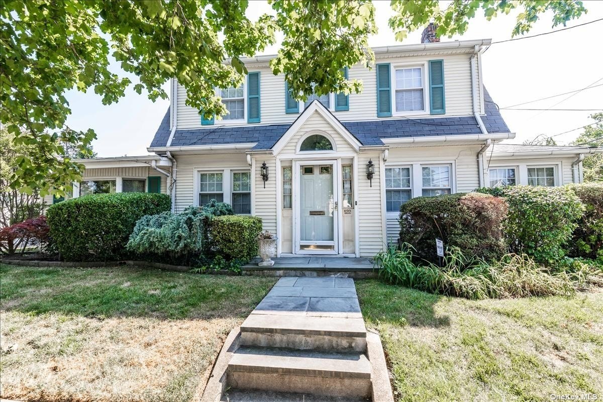 122 Simonson Road Mineola, NY 11501 - Photo 1 of 1 a front view of a house with yard