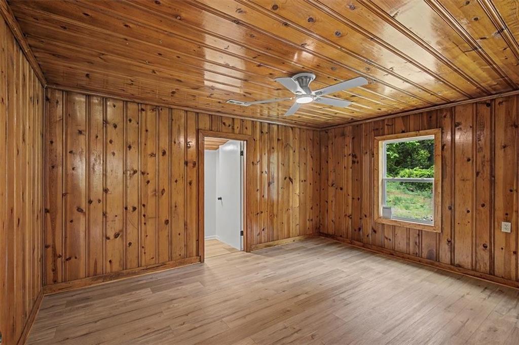 2115 King Road Dalton, GA 30720 - Photo 22 of 54 a view of empty room with wooden floor and fan