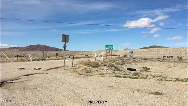 a view of a street with an ocean view