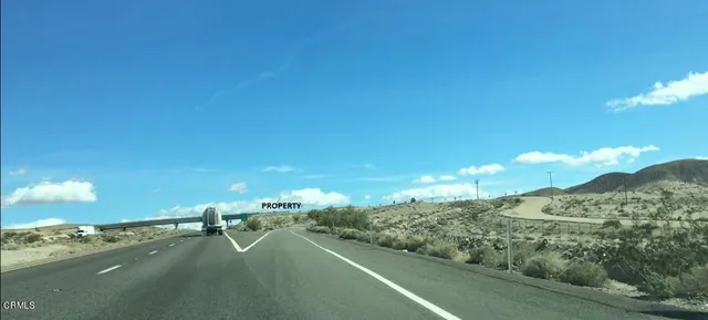 a view of a street with a building in the background