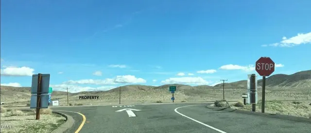 a view of a road with an ocean view