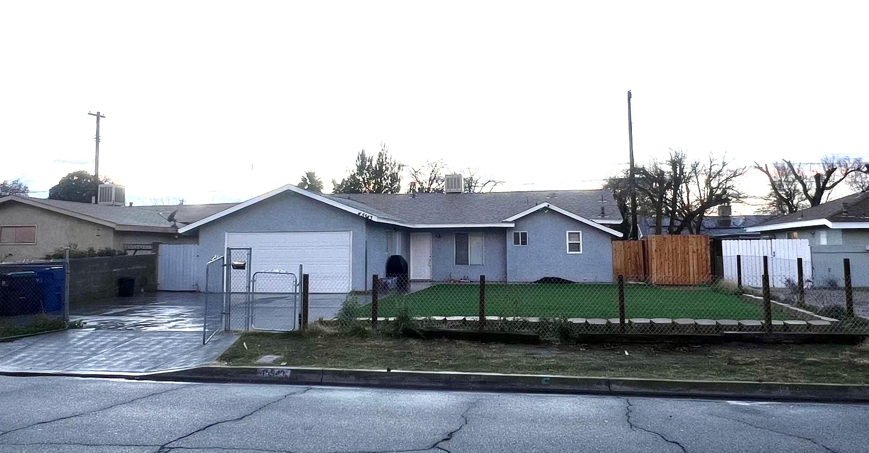 a view of a house next to a yard