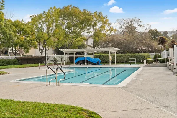 a view of a backyard with sitting area
