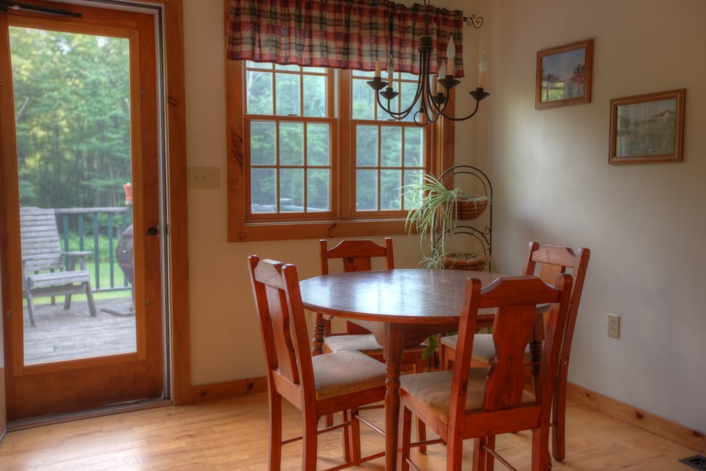 9 Stump Road Sandisfield, MA 01255 - Photo 18 of 29 a view of a dining room with furniture window and wooden floor