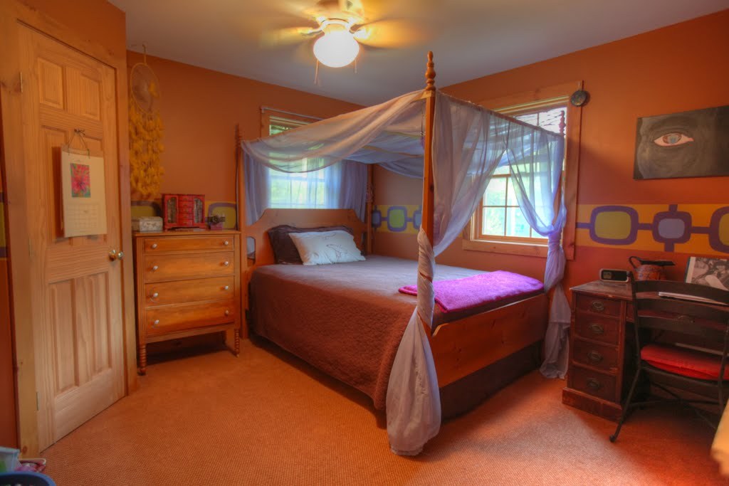 9 Stump Road Sandisfield, MA 01255 - Photo 23 of 29 a bedroom with a bed and a chandelier