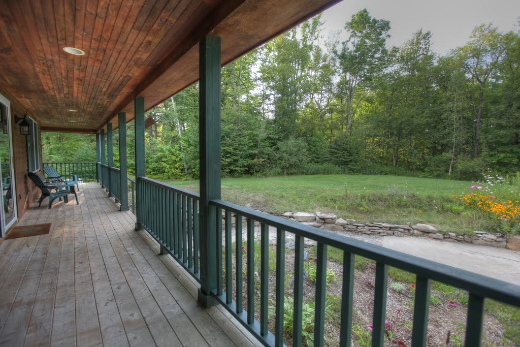 9 Stump Road Sandisfield, MA 01255 - Photo 4 of 29 a view of a wooden deck with a yard