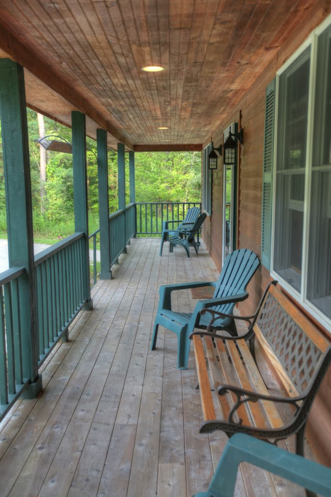 9 Stump Road Sandisfield, MA 01255 - Photo 5 of 29 a view of a patio with table and chairs with wooden floor and fence
