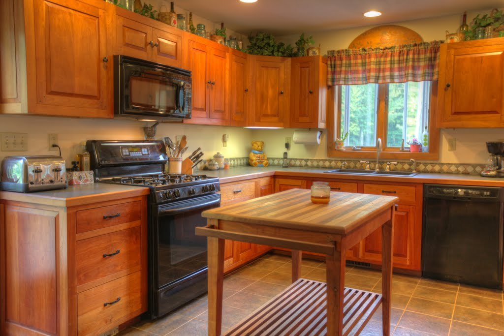 9 Stump Road Sandisfield, MA 01255 - Photo 9 of 29 a kitchen with stainless steel appliances granite countertop wooden cabinets a stove top oven a sink and dishwasher