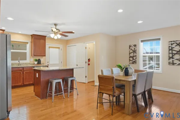 a view of a dining room with furniture and wooden floor
