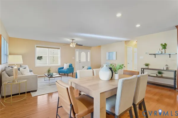 a view of a dining room with furniture and wooden floor