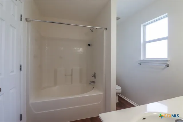 a bathroom with a shower and a bathtub