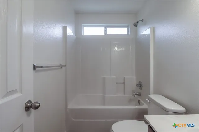 a bathroom with a shower and bathtub