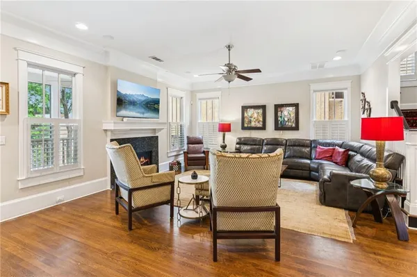 a living room with furniture a dining table and kitchen view
