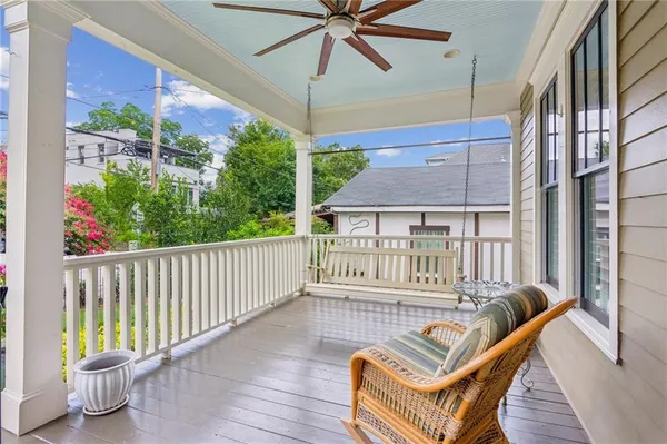 a view of a balcony with furniture