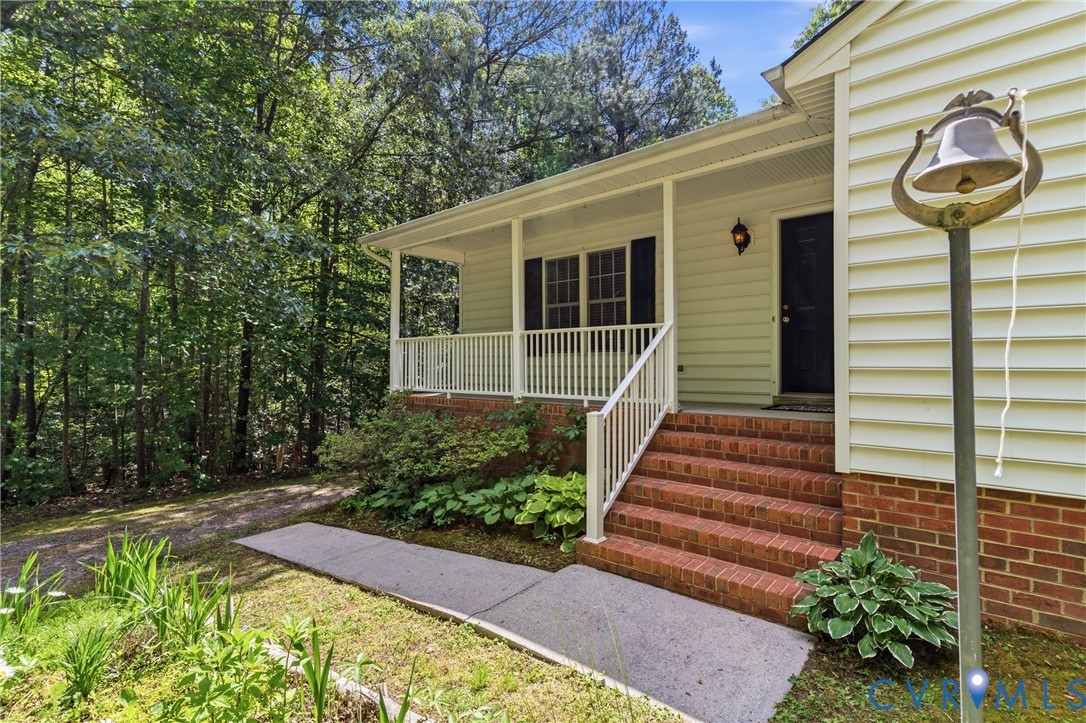 12654 Mt Olive Cohoke Road West Point, VA 23181 - Photo 4 of 31 a front view of a house with garden