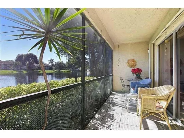 a balcony view with a sitting space