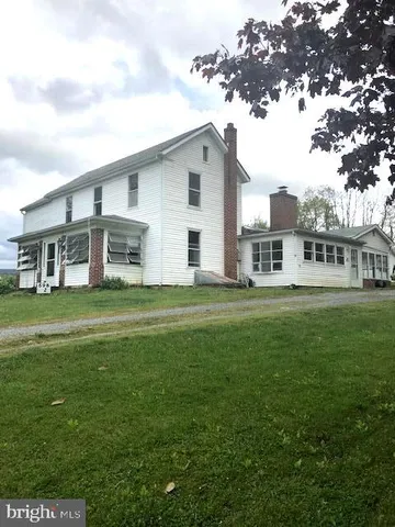 a kitchen with a stove a sink and a refrigerator