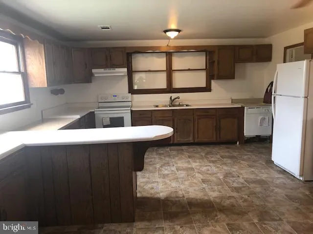 a view of a house with a big yard