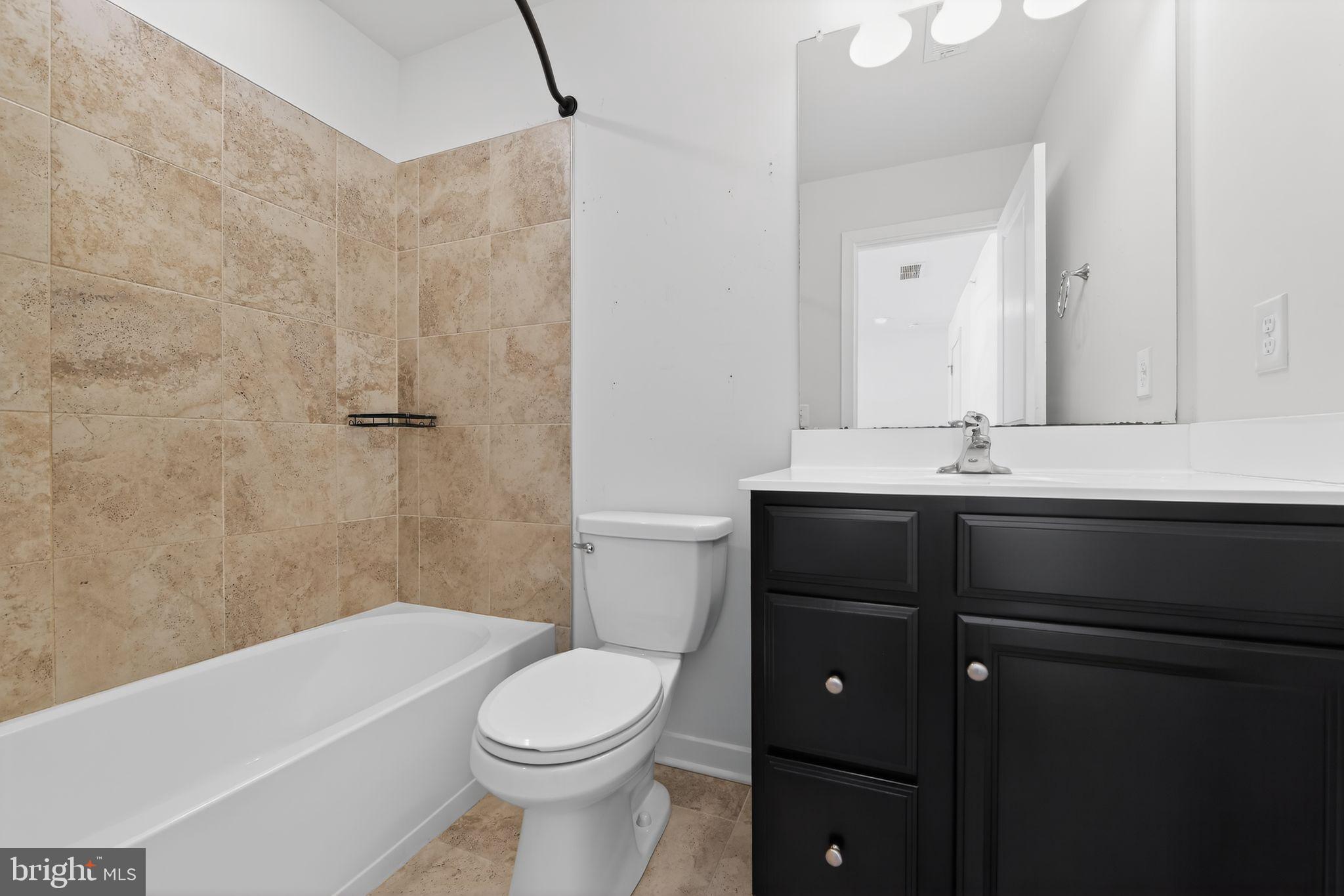 78 Wil-Be Drive Pottstown, PA 19465 - Photo 13 of 18 a bathroom with a sink a toilet and shower