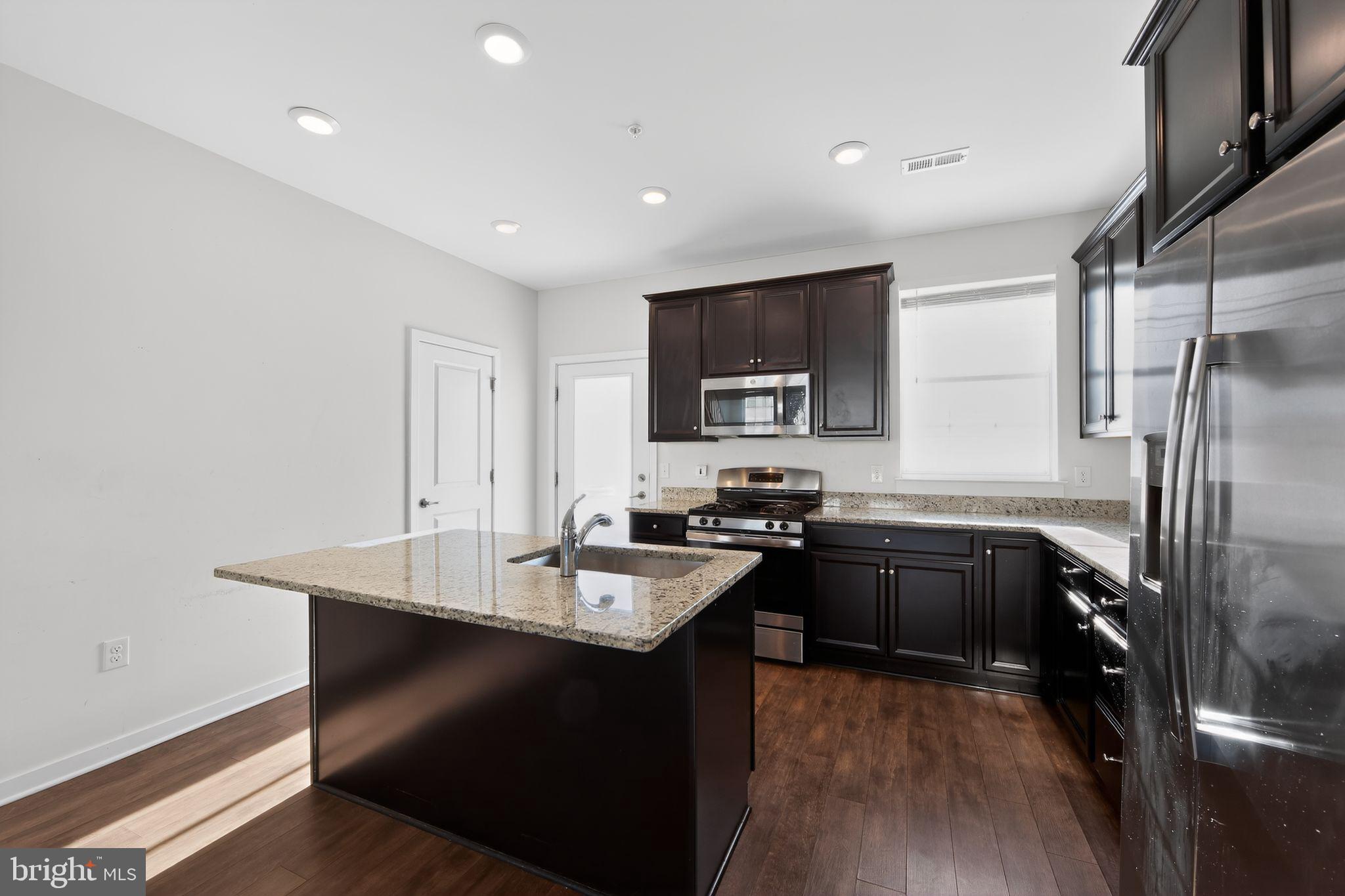 78 Wil-Be Drive Pottstown, PA 19465 - Photo 3 of 18 a kitchen with a sink appliances and cabinets