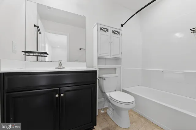 a bathroom with a sink a toilet and a bathtub