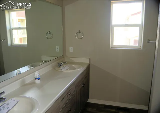 a bathroom with a sink and a window