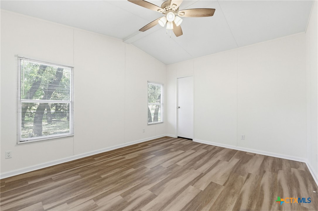 2739 Willow Loop Kempner, TX 76539 - Photo 13 of 30 a view of an empty room with wooden floor and a window