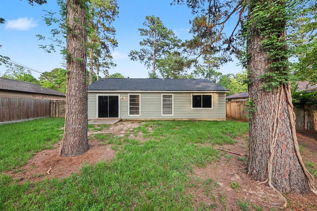 1321 North 7th Street Conroe, TX 77301 - Photo 17 of 17 front view of a house with a yard