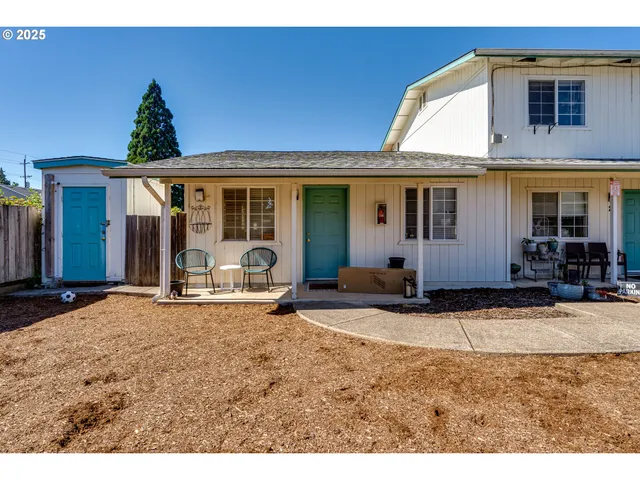 a kitchen with a refrigerator and a sink