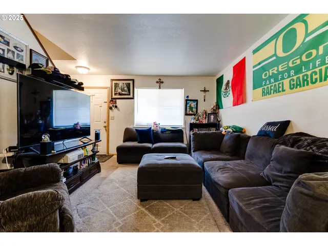 a kitchen with stainless steel appliances kitchen island granite countertop a sink and cabinets