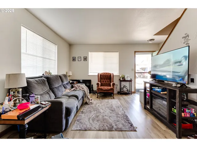 a bathroom with a sink a toilet and a shower curtain