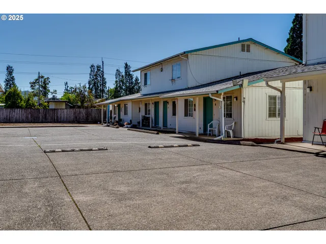 a view of a car parked in front of a house