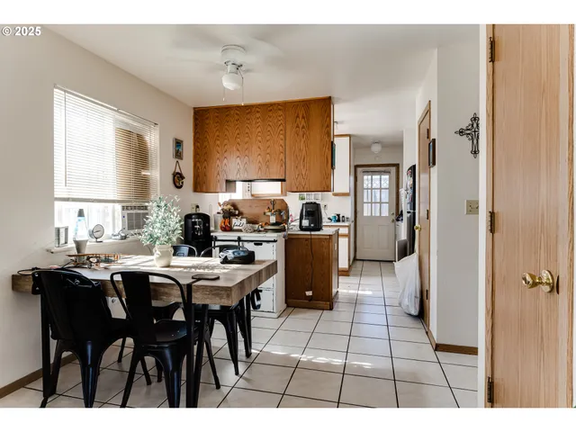 a kitchen with a sink cabinets and window