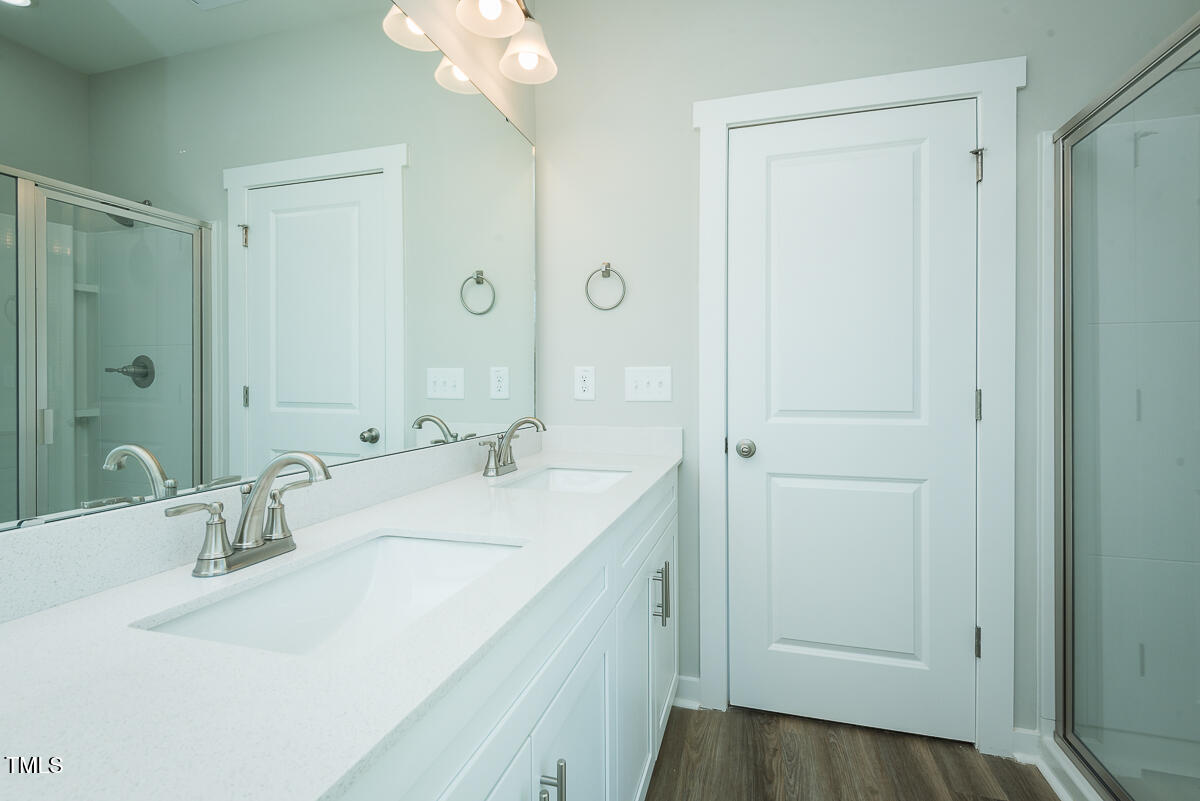 2812 Ricolden Trail Elon, NC 27244 - Photo 11 of 25 a bathroom with a sink and a mirror
