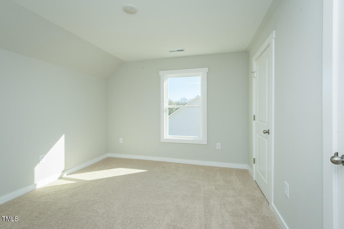 2812 Ricolden Trail Elon, NC 27244 - Photo 12 of 25 an empty room with a window
