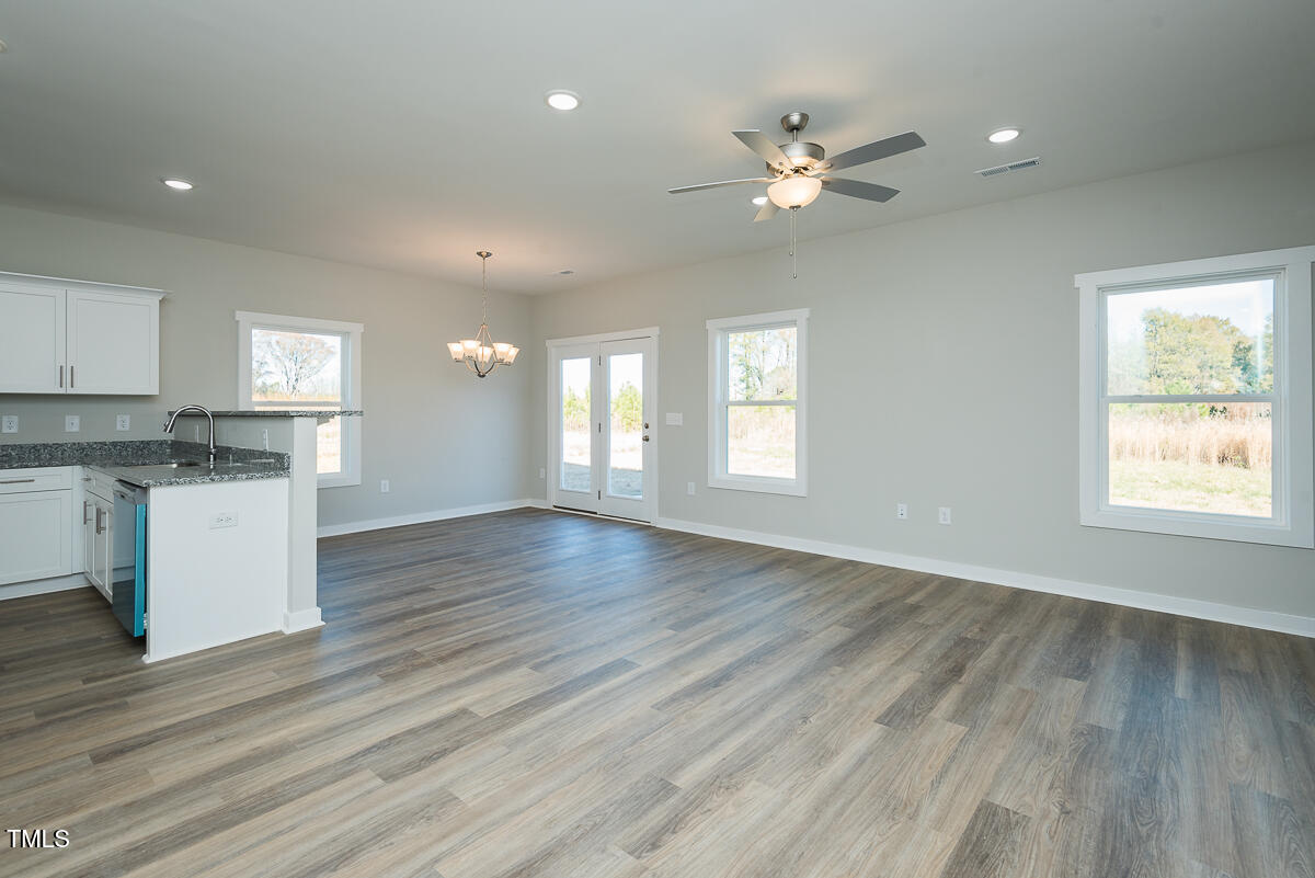 2812 Ricolden Trail Elon, NC 27244 - Photo 20 of 25 a view of an empty room and window and wooden floor