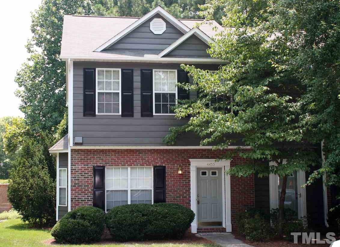 4435 Still Pines Drive Raleigh, NC 27613 - Photo 2 of 19 a front view of a house with a yard garage and outdoor seating